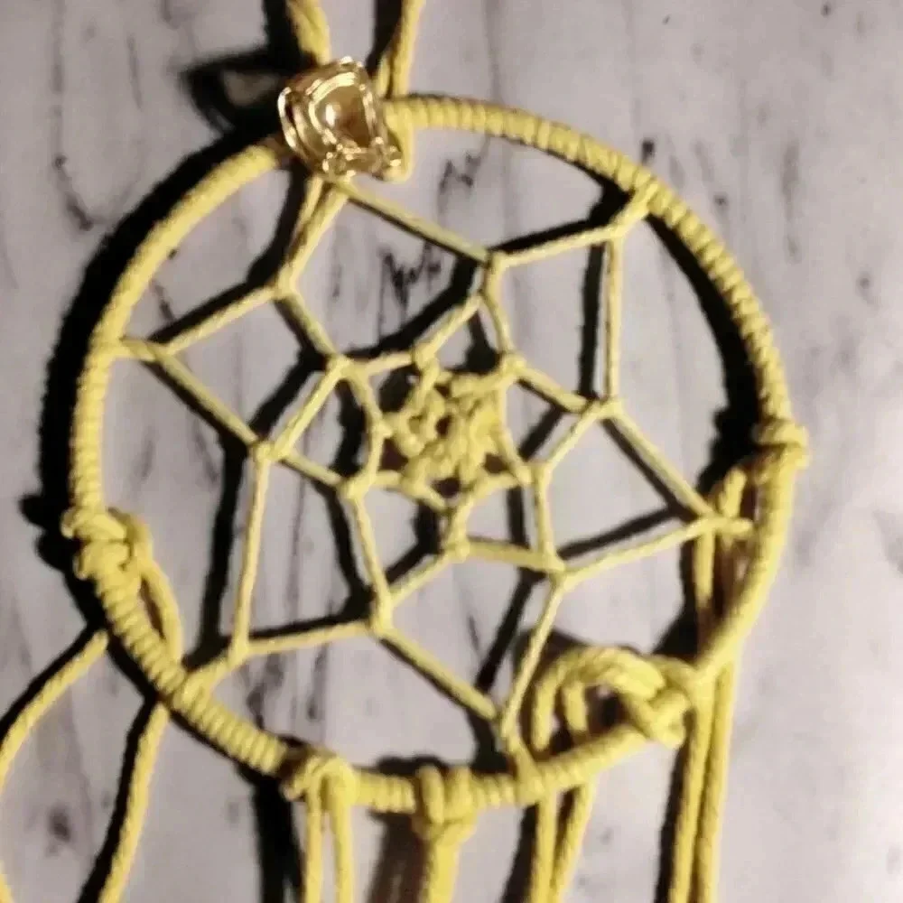 Lorena Espinoza Designs handmade yellow dream catcher with gemstone